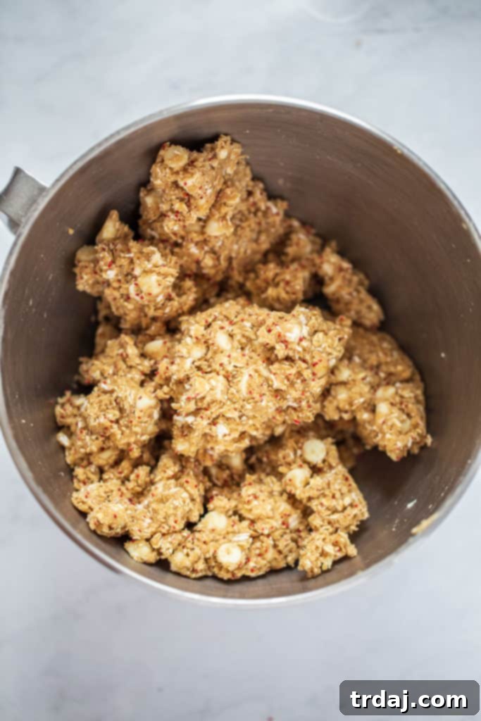 These White Chocolate Cranberry Oatmeal Cookies are soft, chewy and with added health benefits of cranberry seeds making them the BEST recipe! Fold in oats, cranberry seeds and white chocolate chips for white chocolate cranberry oatmeal cookies