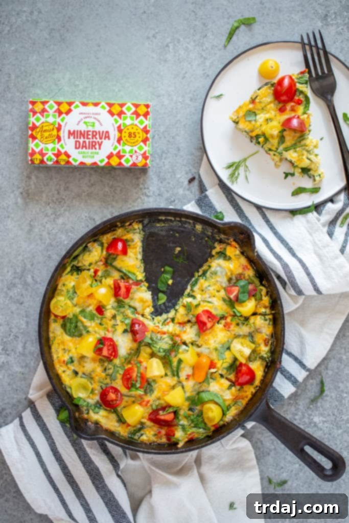 Overhead view of Garden Herb Frittata in a pan with one slice cut out and placed on a plate.