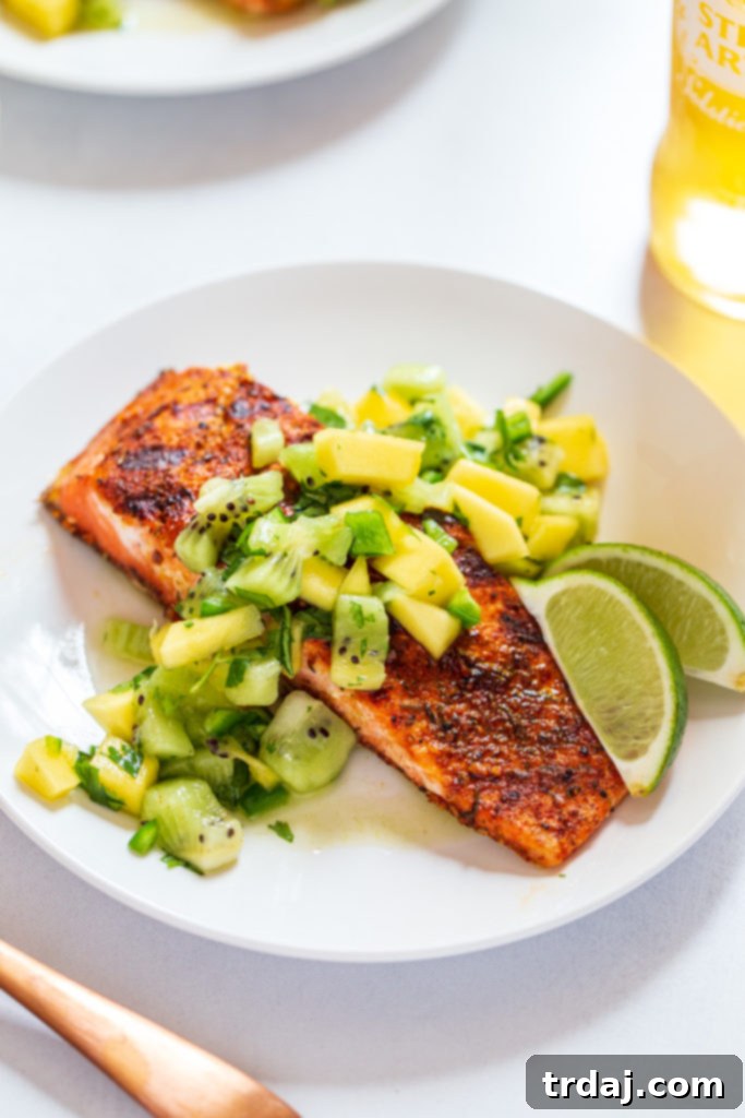 Jerk Salmon with Kiwi Mango Salsa served with grilled romaine salad