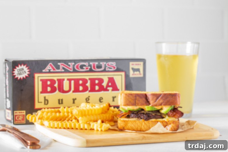 Two halves of a Southwestern Patty Melt showing the layers of avocado, bacon, cheese, and burger