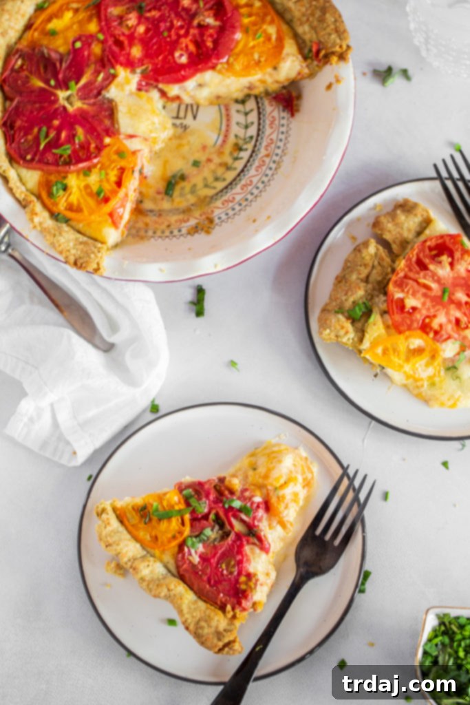 Savory Tomato Pie with a Fresh Herb Crust 9 A slice of tomato pie placed on a plate, ready to be enjoyed.