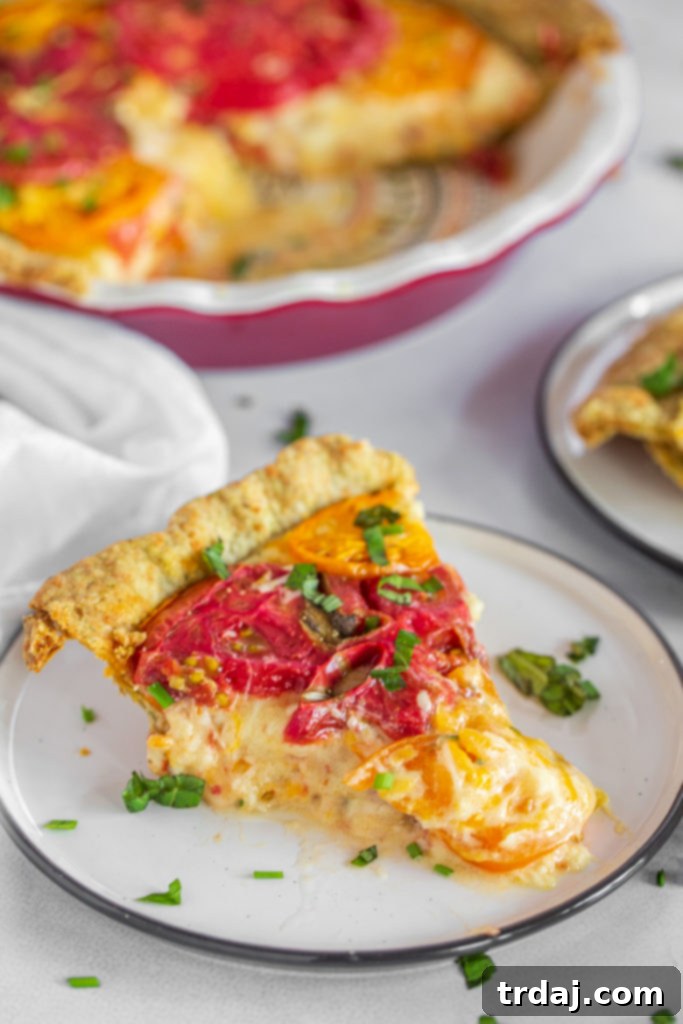 Savory Tomato Pie with a Fresh Herb Crust 4 A beautifully baked tomato pie with a golden-brown herb crust, topped with fresh herbs, ready to be served.