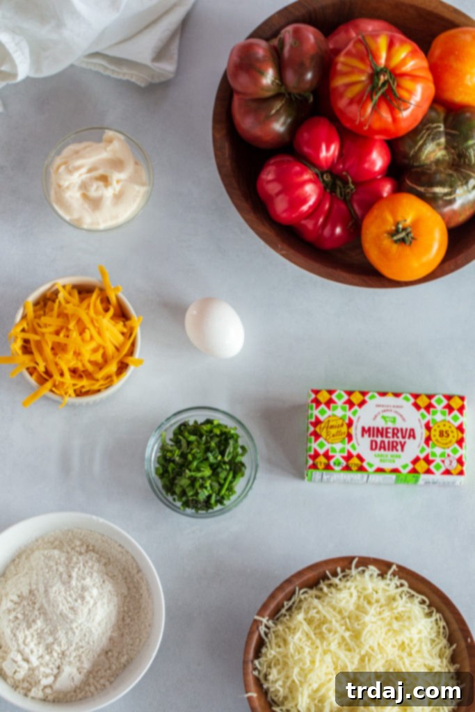 Savory Tomato Pie with a Fresh Herb Crust 5 Ingredients for the tomato pie laid out, including fresh tomatoes, herbs, and cheese.