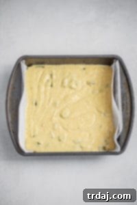 Southwestern Green Chile Cornbread 5 Cornbread batter poured into a parchment-lined baking pan, ready to go into the oven.