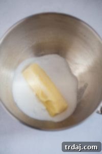 Two images: one showing butter and sugar creaming in a mixer, the other showing eggs being added to the mixture.