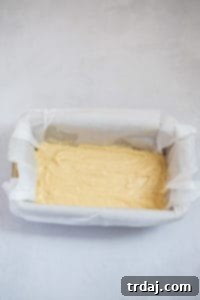 Half of the batter poured into the prepared loaf pan