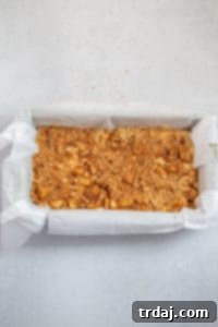 Sprinkling cinnamon sugar over the top layer of apples before baking