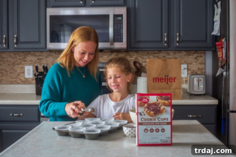 A heartwarming candid photo of a mother and daughter enjoying baking together in the kitchen, creating memories while making treats.