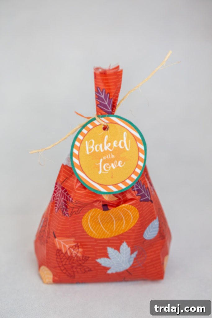 Beautifully packaged Betty Crocker™ Cookie Cups in treat bags, adorned with a 'Baked with Love' printable tag, ready for gifting.