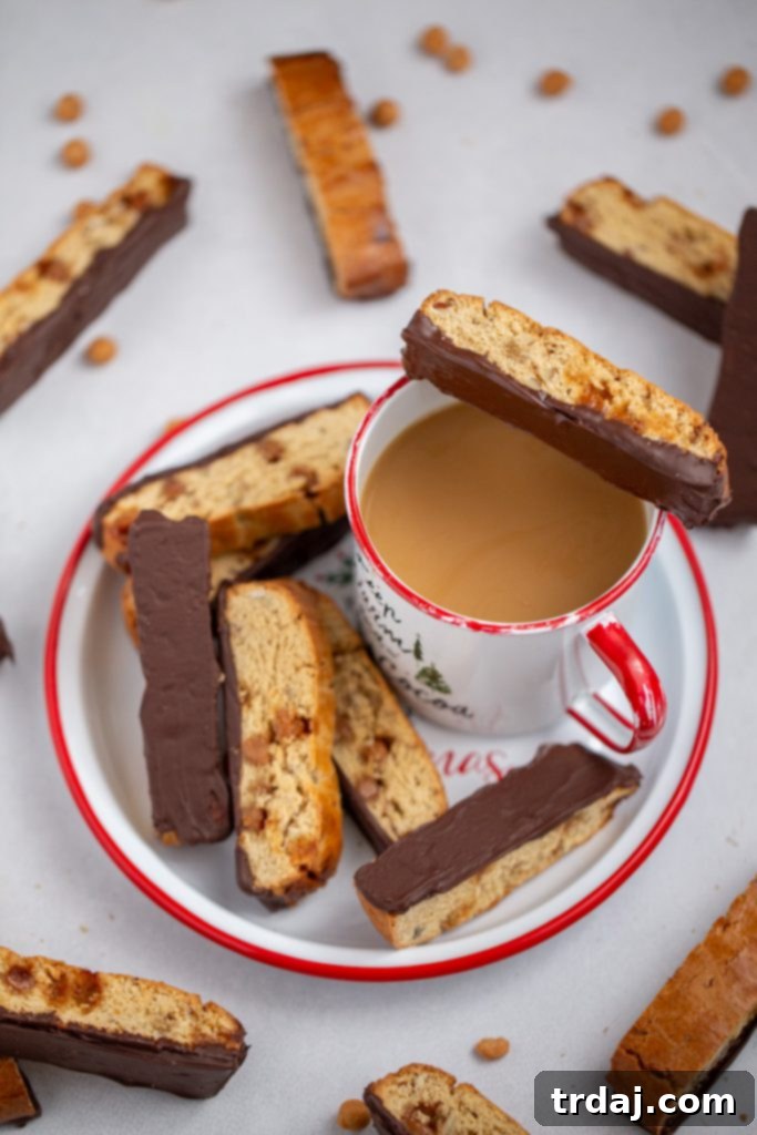 Close-up of freshly baked Turtle Biscotti, ready for dipping.
