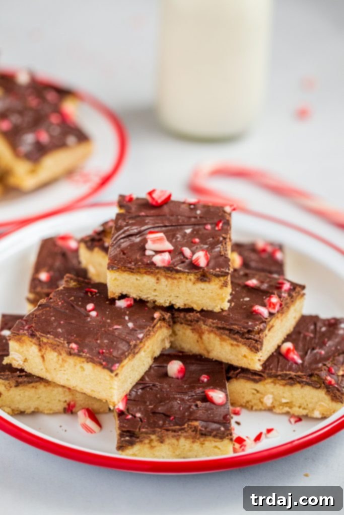 Stacked Peppermint Blondies, a perfect holiday dessert Stack of freshly baked Peppermint Blondies showing their soft, chewy texture and delicious mint-chocolate layers