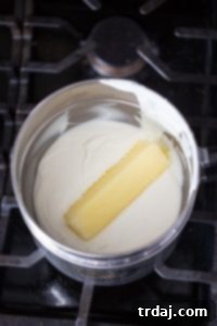 Minty Blondie Bars 2 Melted white chocolate and butter mixture in a bowl, forming the base of the blondie batter