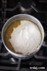 Minty Blondie Bars 4 Dry ingredients and white chocolate chips being folded into the blondie batter