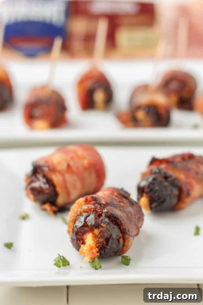 Sweet, creamy, sharp and smoky, these Bacon Wrapped Blue Cheese Stuffed Dates are perfect for your next party! 3 ingredients and super simple, these are sure to be your next go to appetizer for all those upcoming holiday festivities. | Strawberry Blondie Kitchen