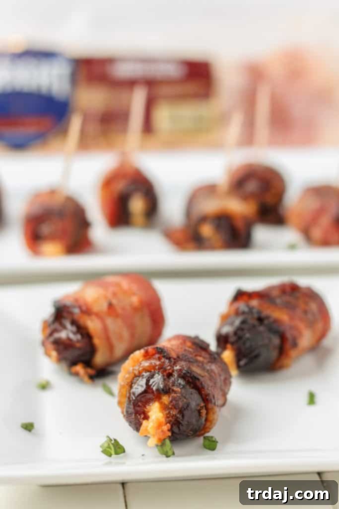 Sweet, creamy, sharp and smoky, these Bacon Wrapped Blue Cheese Stuffed Dates are perfect for your next party! 3 ingredients and super simple, these are sure to be your next go to appetizer for all those upcoming holiday festivities. | Strawberry Blondie Kitchen