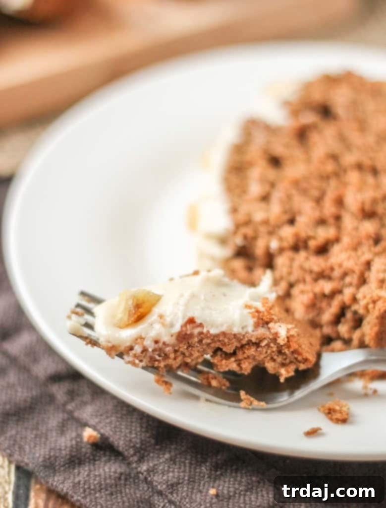 The finished Gingerbread Loaf, beautifully frosted with nutmeg cream cheese and garnished with candied ginger. A perfect low-sugar holiday treat made with SPLENDA® for guilt-free enjoyment. | Strawberry Blondie Kitchen