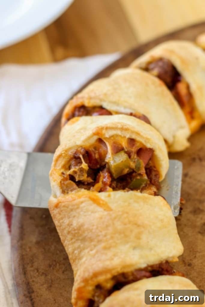 Close-up of a golden brown Chili Cheese Dog Crescent Ring, ready to be served at a football party.