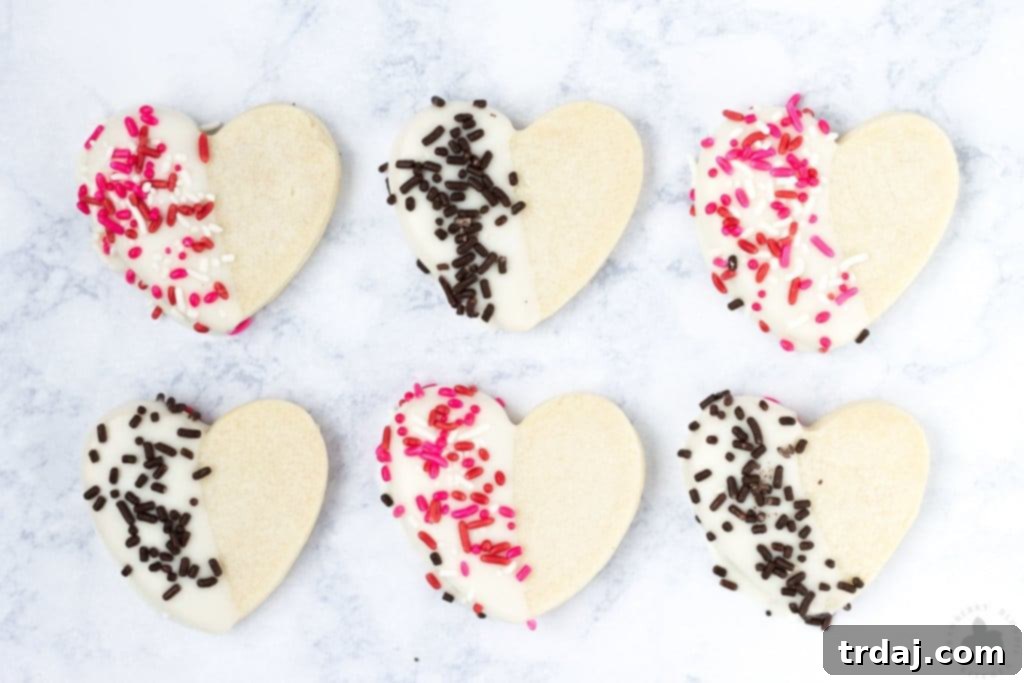 Surprise and delight your Valentine with these White Chocolate Cranberry Shortbread Heart Cookies. Nothing says I love you more than fresh home baked cookies shaped like hearts, dipped in white chocolate and covered in sprinkles!