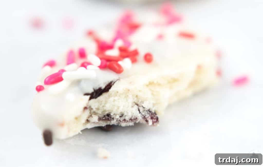 Surprise and delight your Valentine with these White Chocolate Cranberry Shortbread Heart Cookies. Nothing says I love you more than fresh home baked cookies shaped like hearts, dipped in white chocolate and covered in sprinkles!