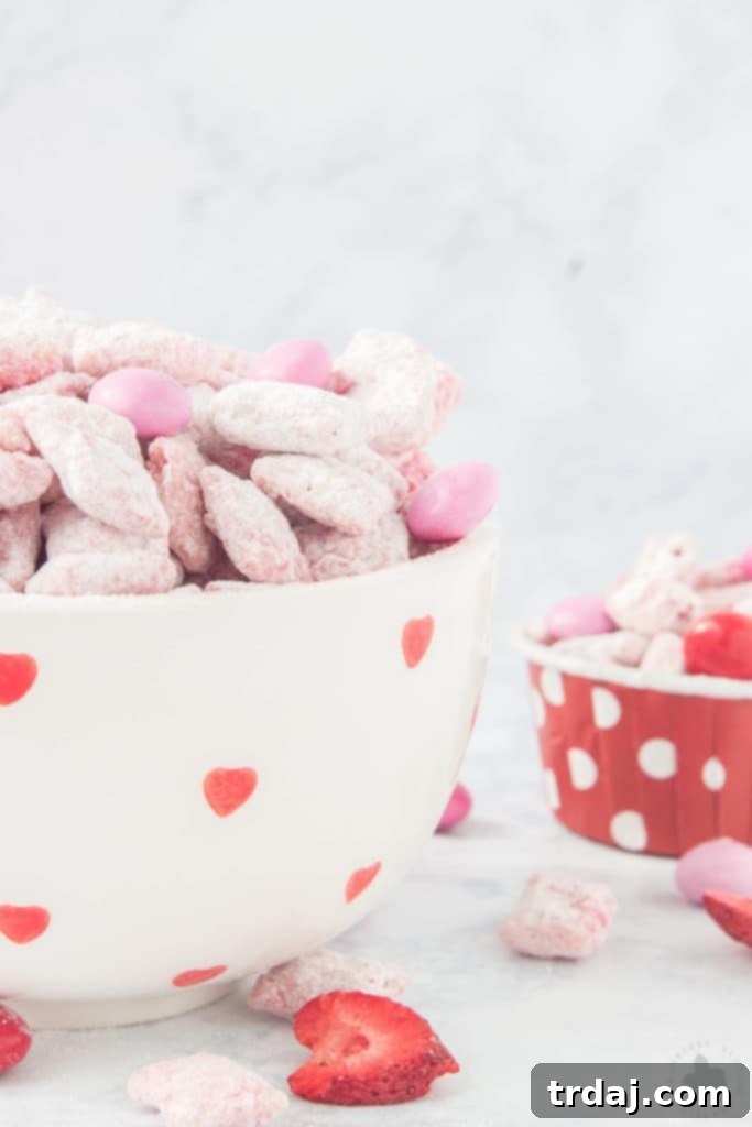 A final close-up of Strawberry Puppy Chow, emphasizing its delicious texture and festive appeal