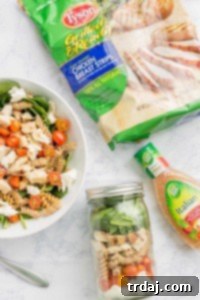 Quick and easy, healthy, portable and delicious, this Layered Chicken Caprese Salad is a meal in a jar. It can be made the night before to save time in the morning or is a perfect prep ahead dinner meal. | Strawberry Blondie Kitchen