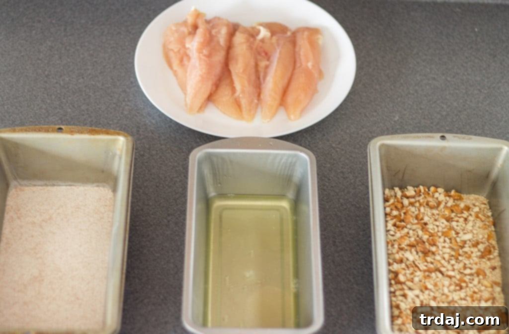 Crispy Pretzel Chicken Tenders with Sweet & Tangy Blackberry Honey Mustard 6 Kids starving after school and you’re tired of feeding them the same ole snack? Try these Pretzel Crusted Chicken Tenders. Chicken Tender strips are coated in Goldfish® Pretzel crackers, baked in the oven and served with a delicious Blackberry honey mustard sauce dipping sauce your kids will love! | Strawberry Blondie Kitchen