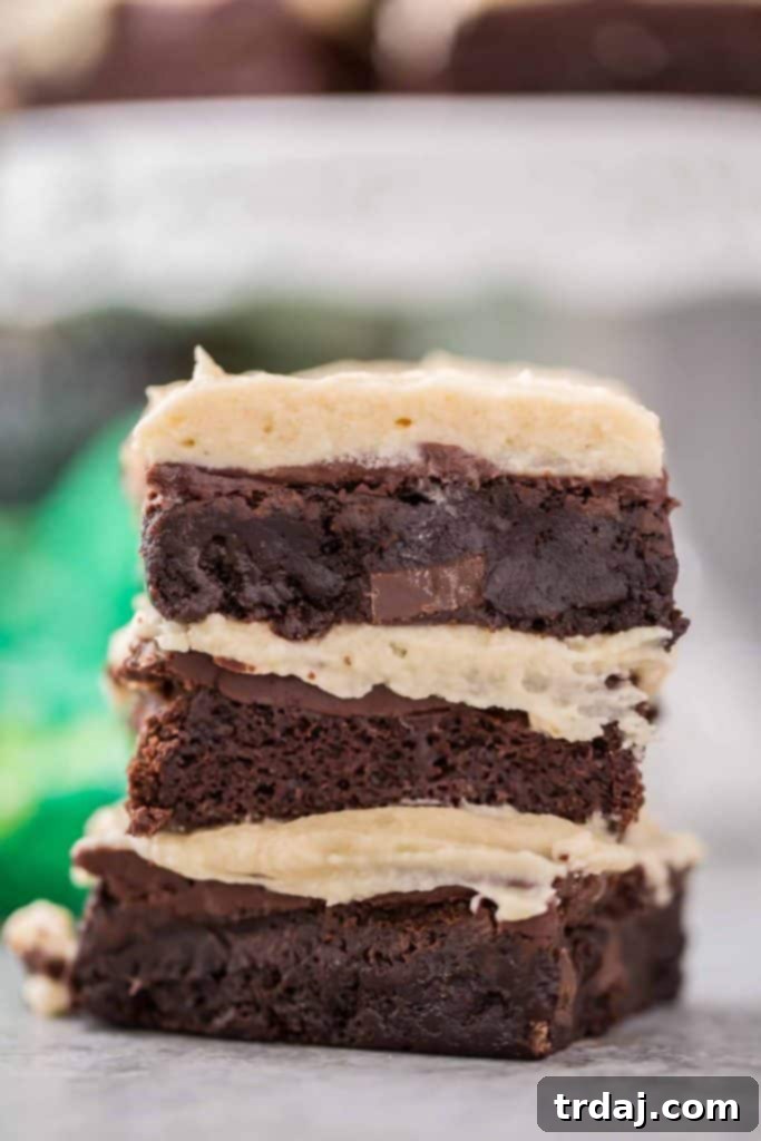 close up of 3 Irish Car Bombs Brownies stacked, revealing their intricate layers and rich texture