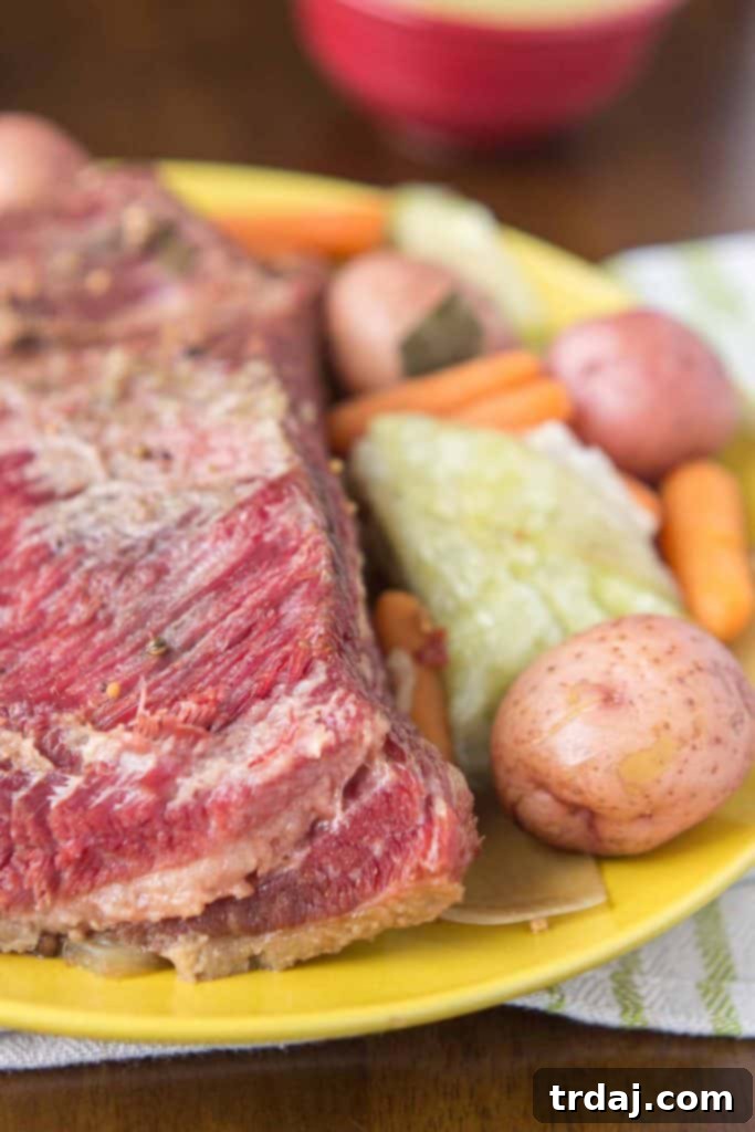 Achieve perfectly tender Slow Cooker Corned Beef with Cabbage and Potatoes for your St. Patrick's Day feast with this easy, hands-off method. Slow Cooker Corned Beef with Cabbage and Potatoes