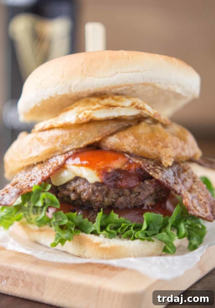Irish Cream & Stout Burger 3 An All American beef patty with Guinness Battered Onion rings, Jameson BBQ sauce and Candied Baileys Bacon, this Irish Car Bomb Burger is literally a flavor bomb! | Strawberry Blondie Kitchen