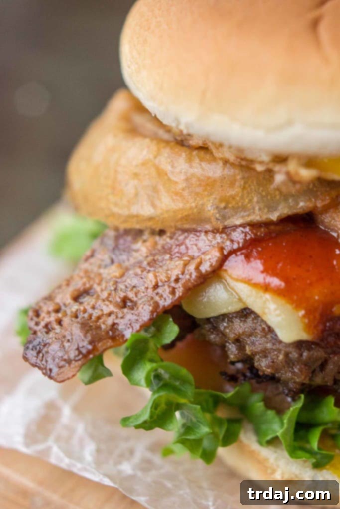 Irish Cream & Stout Burger 4 An All American beef patty with Guinness Battered Onion rings, Jameson BBQ sauce and Candied Baileys Bacon, this Irish Car Bomb Burger is literally a flavor bomb! | Strawberry Blondie Kitchen