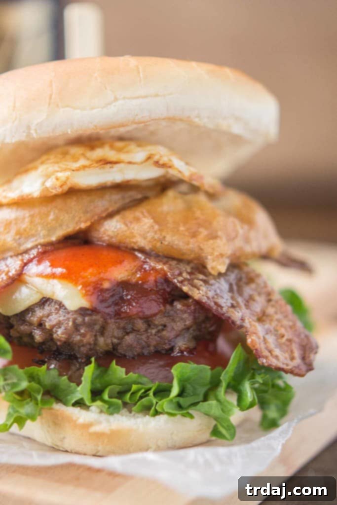 Irish Cream & Stout Burger 5 An All American beef patty with Guinness Battered Onion rings, Jameson BBQ sauce and Candied Baileys Bacon, this Irish Car Bomb Burger is literally a flavor bomb! | Strawberry Blondie Kitchen