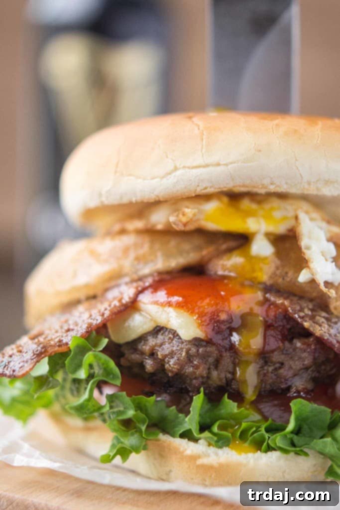 Irish Cream & Stout Burger 6 An All American beef patty with Guinness Battered Onion rings, Jameson BBQ sauce and Candied Baileys Bacon, this Irish Car Bomb Burger is literally a flavor bomb! | Strawberry Blondie Kitchen