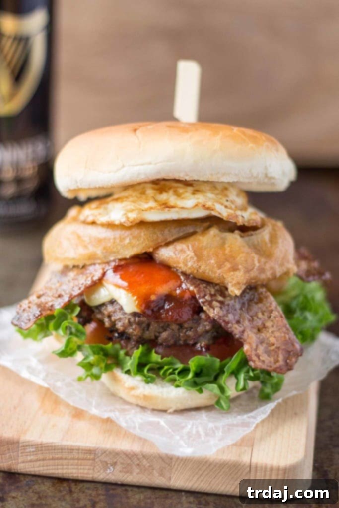Irish Cream & Stout Burger 8 An All American beef patty with Guinness Battered Onion rings, Jameson BBQ sauce and Candied Baileys Bacon, this Irish Car Bomb Burger is literally a flavor bomb! | Strawberry Blondie Kitchen