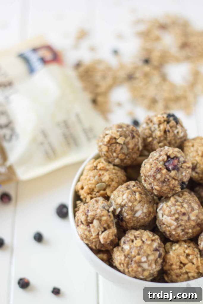 These 4 ingredient, no bake, Blueberry Muffin Energy Bites are the perfect grab and go breakfast or snack. Packed with good for you super grains and seeds, these will be your new and nutritious way to start your day or tackle your afternoon to do list! | Strawberry Blondie Kitchen