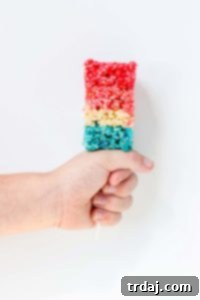 Freedom Fluffs 9 Patriotic Crispy Treats layered with red, white, and blue flavors.