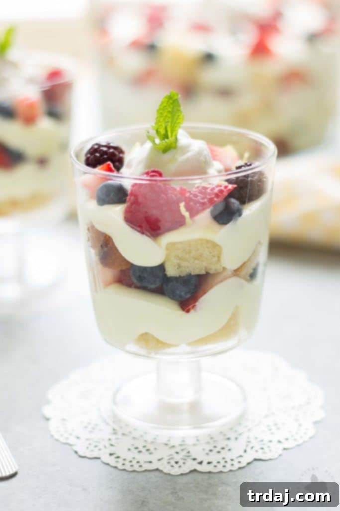 Sunshine Berry Delight 3 Celebrate the bountiful berries of the season with this Lemon Berry Trifle. Strawberries, blueberries, raspberries and blackberries are layered between tart lemon pudding, whipped cream and studded with delicious pound cake. The perfect summer dessert for all your backyard parties! | Strawberry Blondie Kitchen