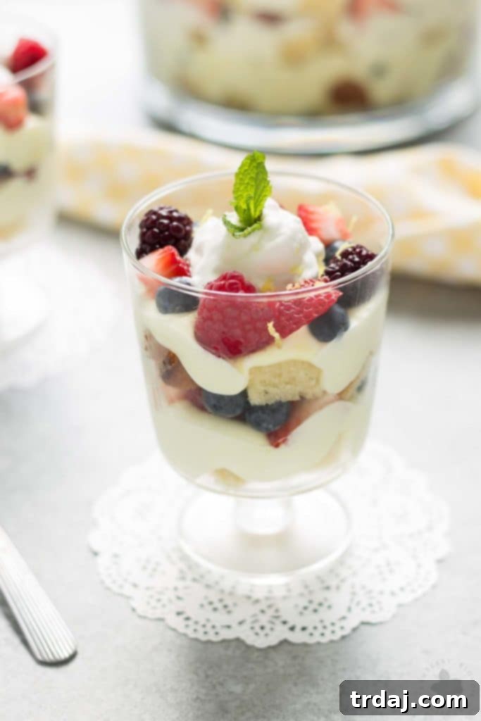 Sunshine Berry Delight 4 Celebrate the bountiful berries of the season with this Lemon Berry Trifle. Strawberries, blueberries, raspberries and blackberries are layered between tart lemon pudding, whipped cream and studded with delicious pound cake. The perfect summer dessert for all your backyard parties! | Strawberry Blondie Kitchen