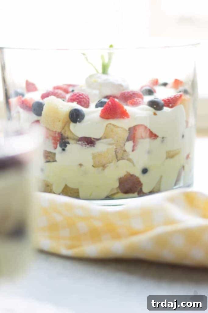 Sunshine Berry Delight 5 Celebrate the bountiful berries of the season with this Lemon Berry Trifle. Strawberries, blueberries, raspberries and blackberries are layered between tart lemon pudding, whipped cream and studded with delicious pound cake. The perfect summer dessert for all your backyard parties! | Strawberry Blondie Kitchen