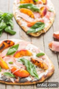 Tender and sweet peaches are a match made in Heaven with salty prosciutto, tangy, creamy goat cheese all piled high on garlic naan bread. This Grilled Peach, Prosciutto and Goat Cheese Pizza will have your taste buds singing the sweet and savory tunes of summer | Strawberry Blondie Kitchen