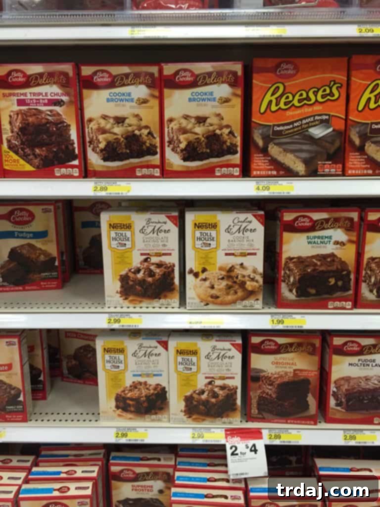 Nestle Toll House cookie dough being prepared, with a box of Cookies & More with Butterfingers mix