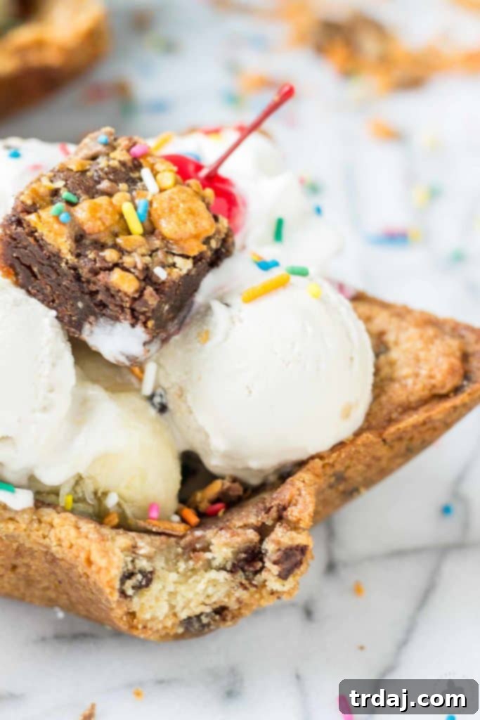 The Ultimate Ice Cream Sundae Bowl overflowing with ice cream, toppings, and chocolate chips