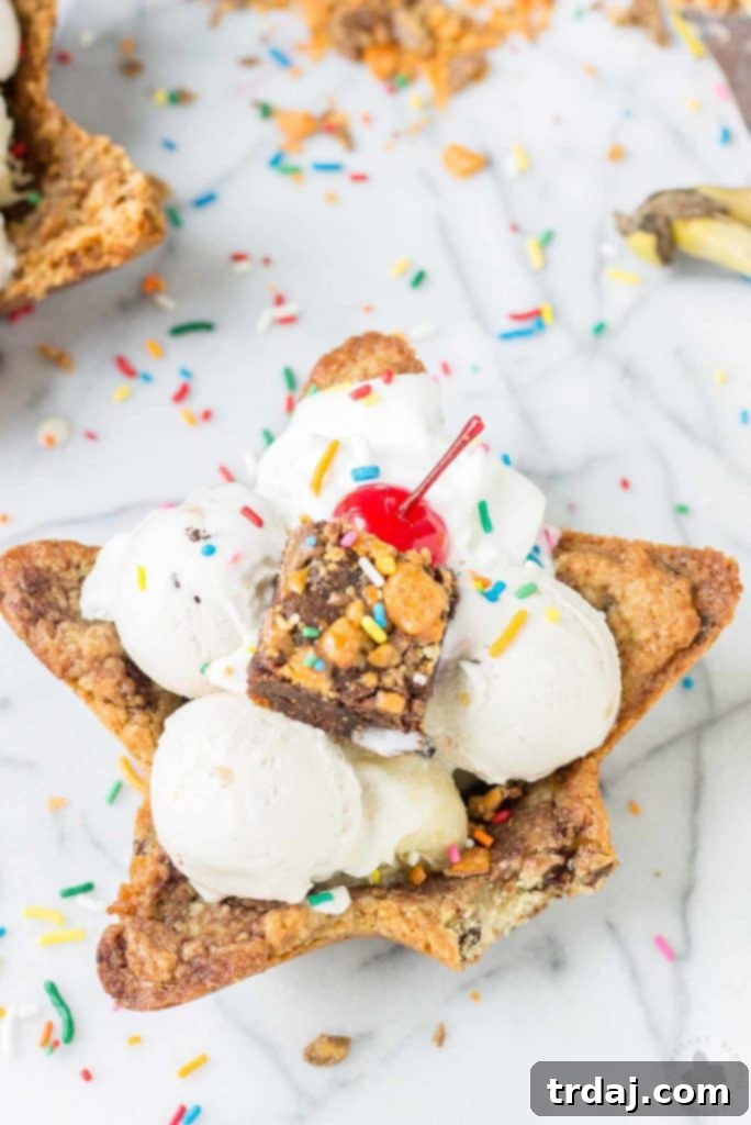 A close-up of The Ultimate Ice Cream Sundae Cookie Bowl, showing the details of the edible cookie and toppings