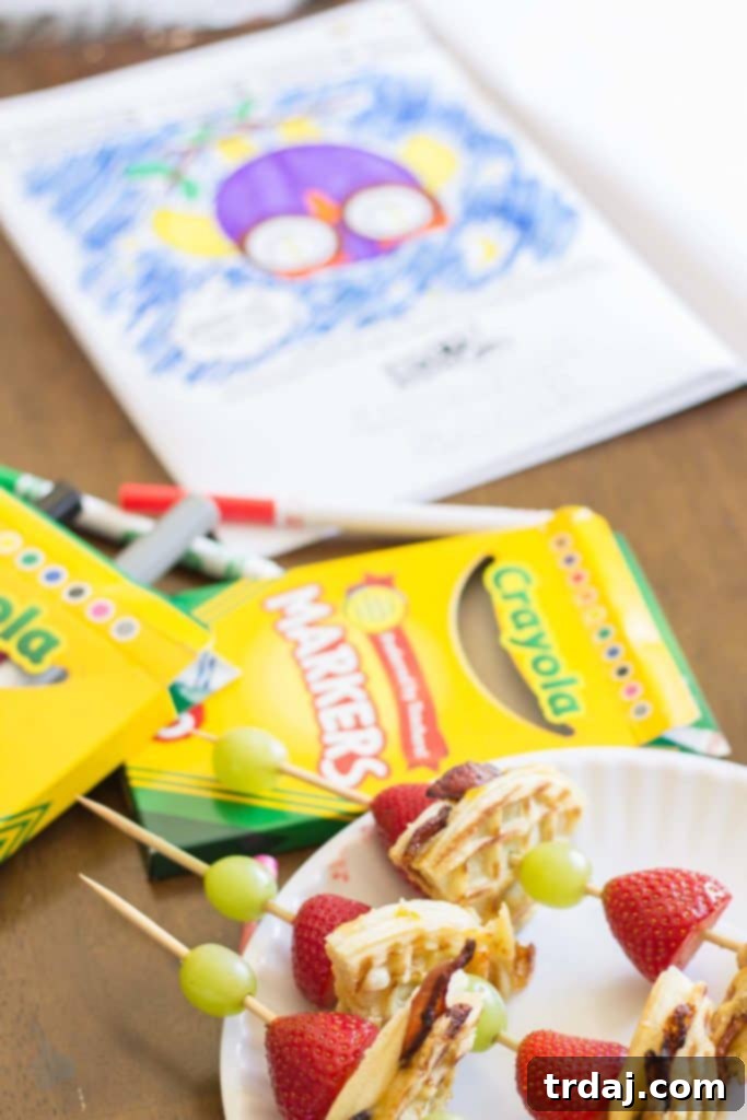 Bacon, Havarti, and Peach Wafflewich kebabs with grapes and strawberries, a fun and creative snack.