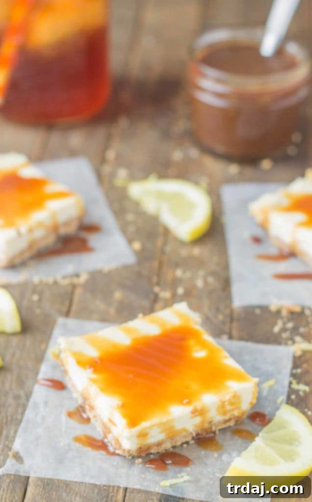 Close-up of a single Arnold Palmer Cheesecake Bar on a white plate, showcasing the lemon cheesecake base and sweet tea caramel topping.