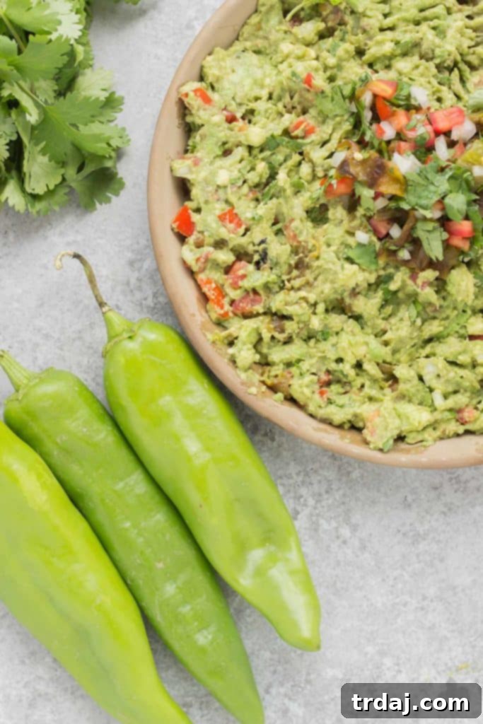 A close-up view of roasted Hatch chiles, ready for peeling
