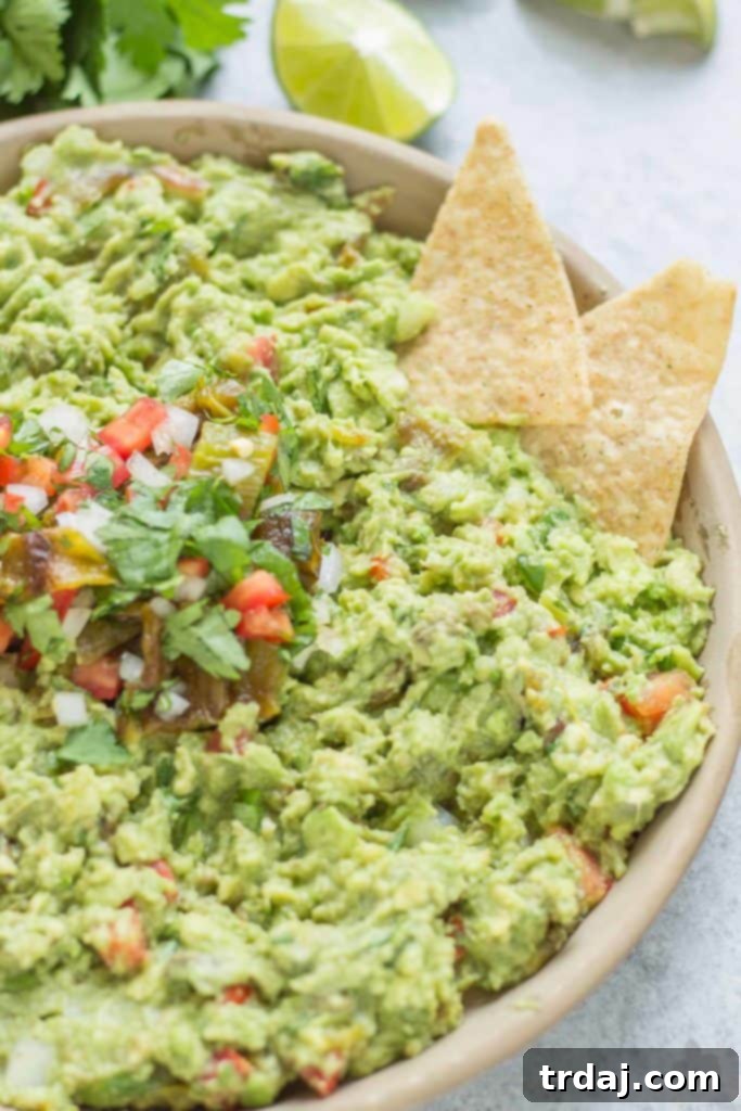 A serving bowl filled with creamy Hatch Chile Guacamole