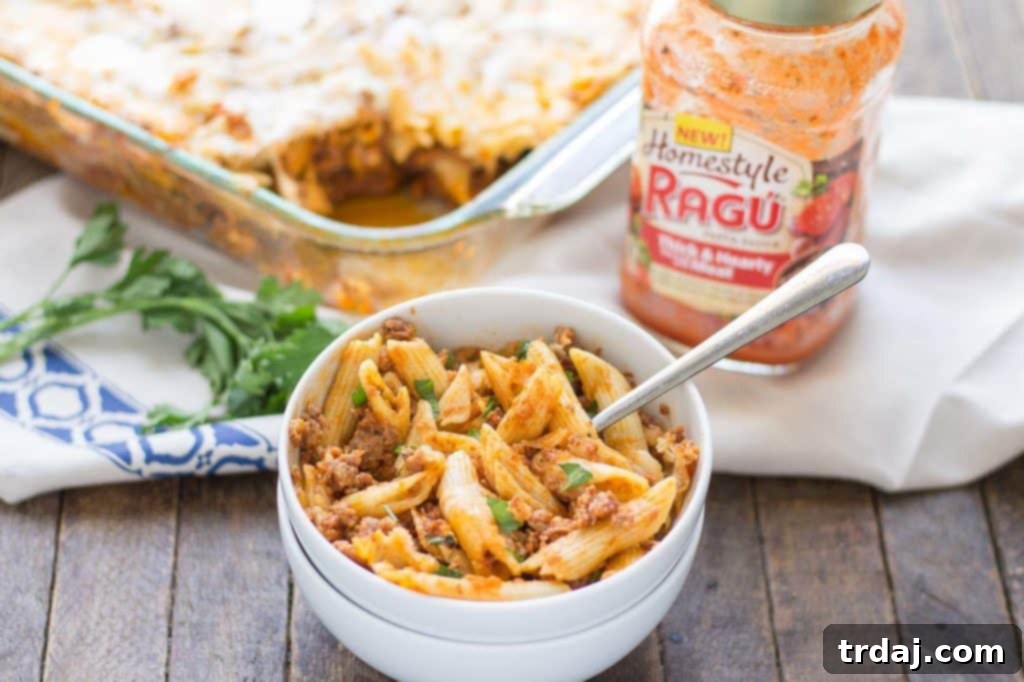 Overhead shot of a full casserole dish of Baked Mostaccioli, ready for a family gathering.