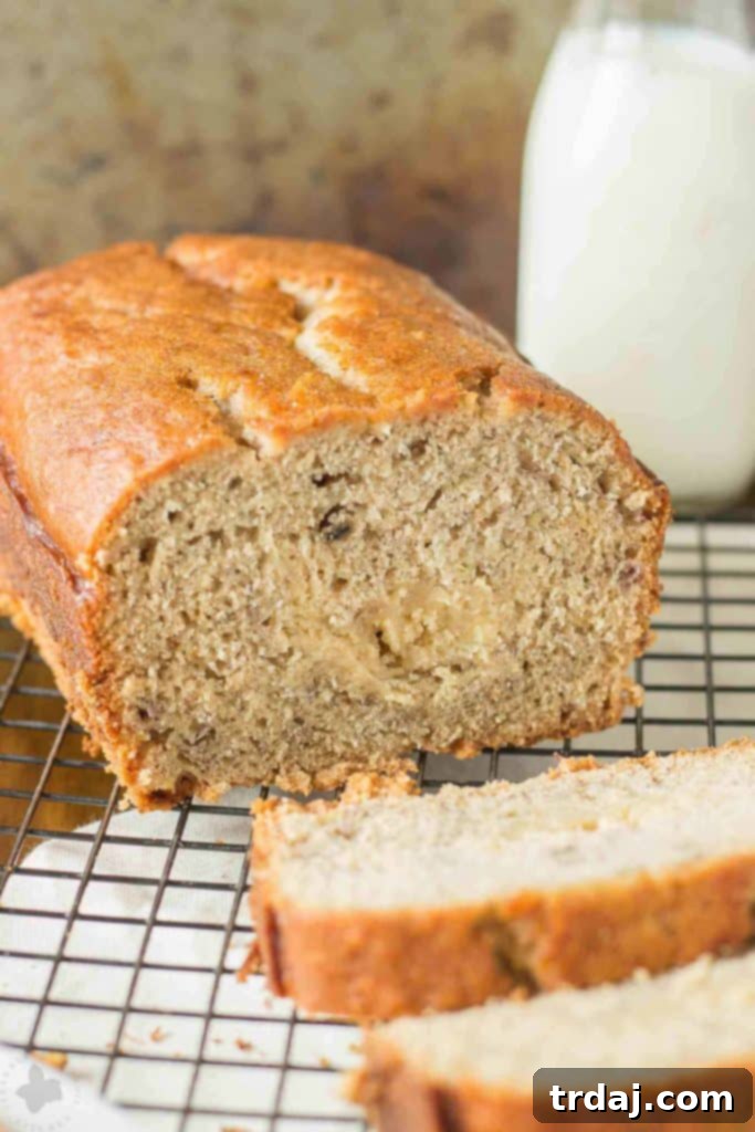 Super moist banana bread is ribboned with brown sugar cream cheese and aromatic spices making this Brown Sugar Stuffed Banana Bread one outstanding quick bread. It's sure to be the last banana bread recipe you'll ever need! | Strawberry Blondie Kitchen