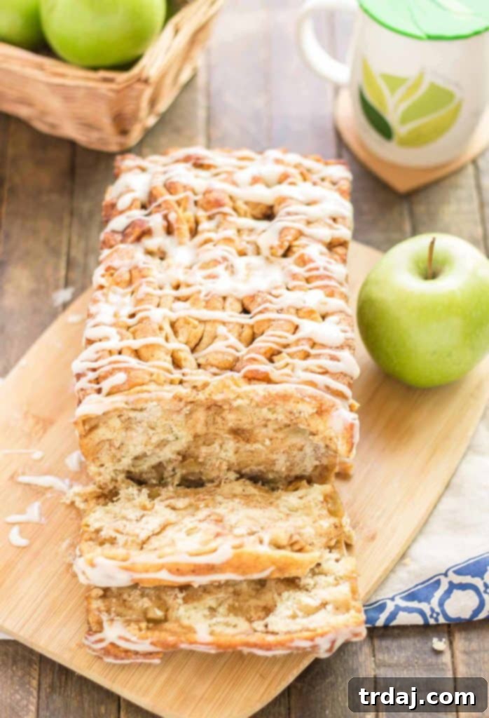 Apple Pie Pull Apart Bread is filled with chopped apples, cinnamon, brown sugar and drizzled with a cream cheese glaze. Sure to give Apple Pie a run for its money! | Strawberry Blondie Kitchen