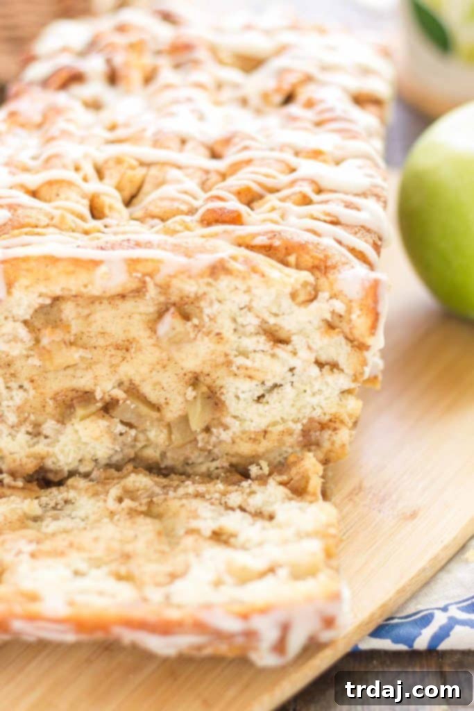 Apple Pie Pull Apart Bread is filled with chopped apples, cinnamon, brown sugar and drizzled with a cream cheese glaze. Sure to give Apple Pie a run for its money! | Strawberry Blondie Kitchen